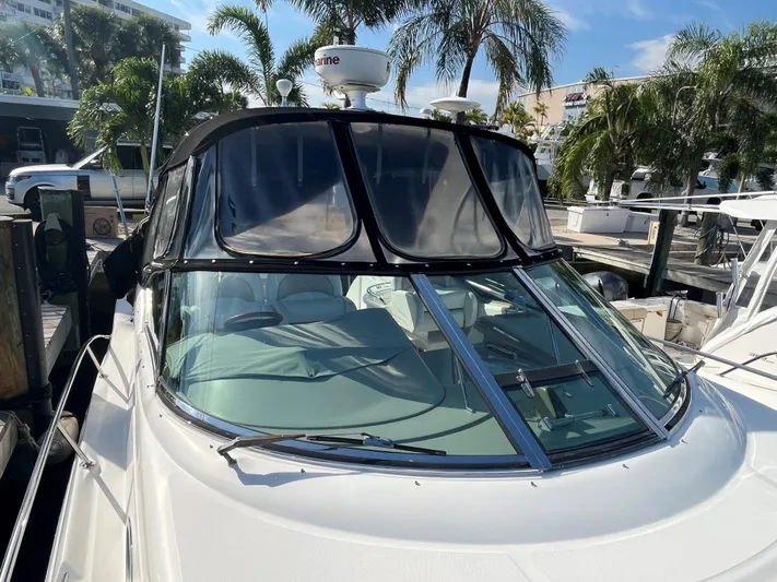  Yacht Photos Pics 2008 Sea Ray 340 Sundancer boat docked, surrounded by palm trees and clear skies.