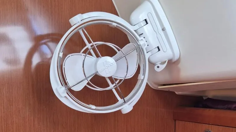 1702 Yacht Photos Pics Small white fan mounted on a wooden surface inside a 2010 Beneteau Oceanis 43 yacht.