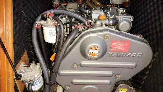 1702 Yacht Photos Pics Yanmar engine in a 2010 Beneteau Oceanis 43 sailboat, showcasing mechanical components.