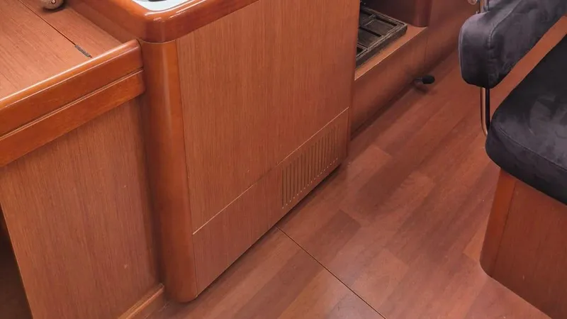 1702 Yacht Photos Pics Interior of 2010 Beneteau Oceanis 43 yacht, featuring wooden cabinetry and flooring.