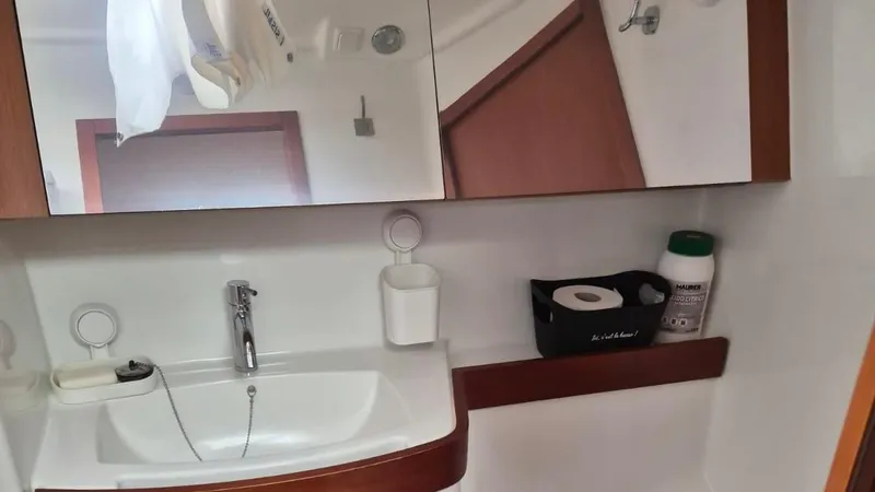 1702 Yacht Photos Pics Bathroom interior of 2010 Beneteau Oceanis 43 yacht with sink and mirror.