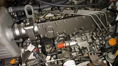 1702 Yacht Photos Pics Engine of a 2010 Beneteau Oceanis 43 sailboat, showcasing intricate mechanical components.