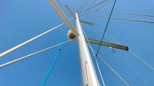 1702 Yacht Photos Pics Mast and rigging of a 2010 Beneteau Oceanis 43 sailboat against a clear blue sky.