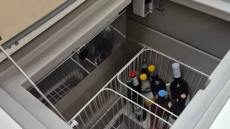 1702 Yacht Photos Pics Refrigerator with beverages inside a 2010 Beneteau Oceanis 43 yacht.