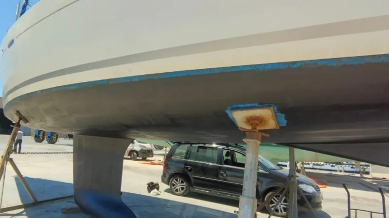 1702 Yacht Photos Pics Beneteau Oceanis 43 sailboat hull, 2010 model, on dry dock for maintenance.