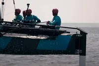 Sailors in action on a GC 32 catamaran, 2012 model, navigating the sea.