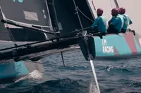 Sailing team racing on GC 32 catamaran, 2012 model, in open water.