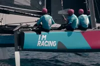 Sailing team on GC 32 catamaran, 2012, with "I'm Racing" text on hull.