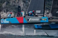 Sailing team racing on a GC32 catamaran, 2012, with vibrant branding.