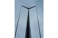 Tall sailboat mast with rigging against cloudy sky, GC 32 model, 2012.