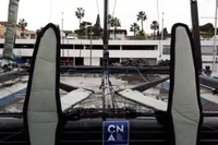 Sailboat deck with padded supports, CN logo, palm trees in background, GC 32 model, 2012.