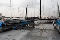 Sailboat GC 32 from 2012 on a wet dock, surrounded by other boats.