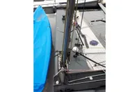 Sailboat deck with rigging, blue tarp, and netting, GC 32 model, 2012.
