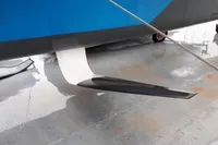 Sleek GC 32 hydrofoil sailboat component on wet surface, 2012 model.