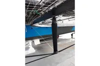Underneath view of a 2012 GC 32 catamaran with netting and structural components.