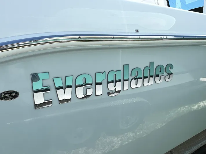 Whisper Gray Yacht Photos Pics 2025 Everglades 315 Center Console boat logo on hull.