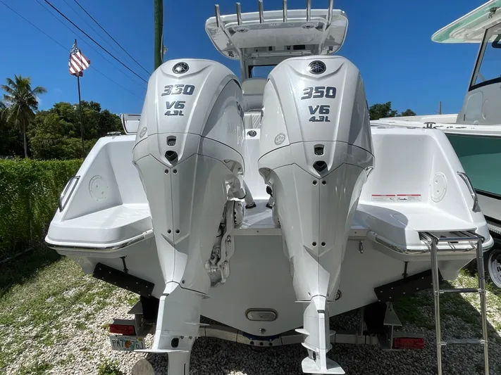 Whisper Gray Yacht Photos Pics 2025 Everglades 315 Center Console with twin 350 V6 outboard engines, rear view.