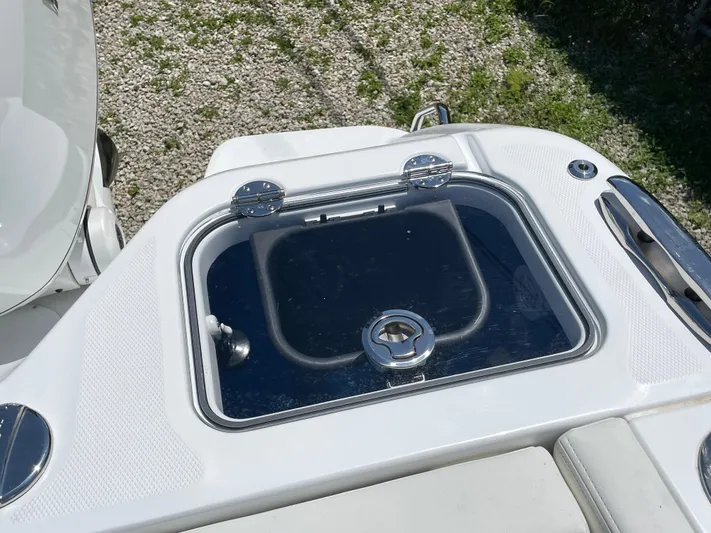 Whisper Gray Yacht Photos Pics Livewell on 2025 Everglades 315 Center Console boat, featuring sleek design and chrome accents.