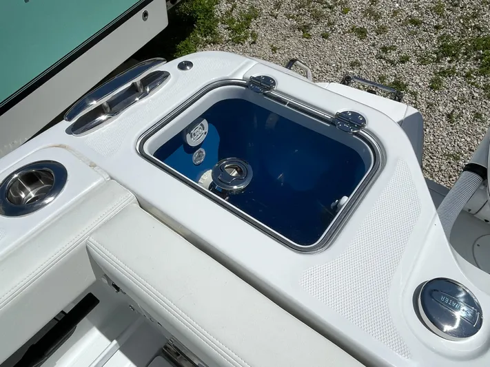 Whisper Gray Yacht Photos Pics 2025 Everglades 315 Center Console boat with sleek white seating and built-in storage.