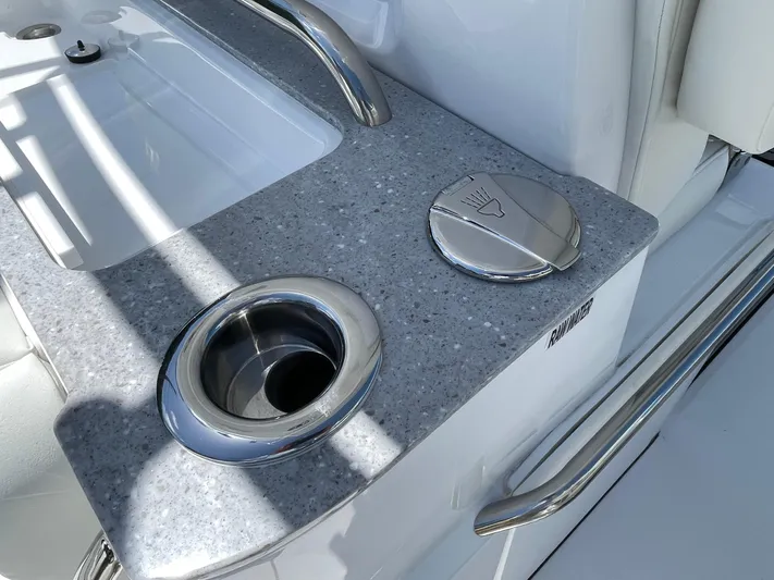 Whisper Gray Yacht Photos Pics 2025 Everglades 315 Center Console boat sink and cup holder detail.