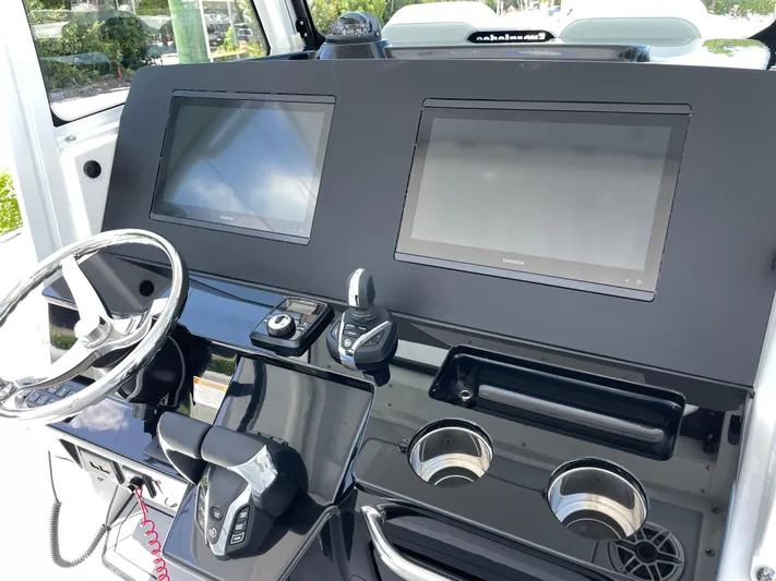 Whisper Gray Yacht Photos Pics 2025 Everglades 315 Center Console dashboard with dual screens and steering wheel.