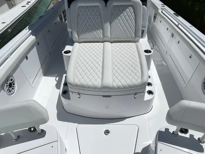 Whisper Gray Yacht Photos Pics 2025 Everglades 315 Center Console boat with luxurious white seating and modern design.
