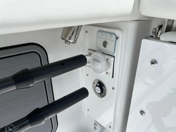 Whisper Gray Yacht Photos Pics Control panel on 2025 Everglades 315 Center Console boat, featuring switches and rod holders.