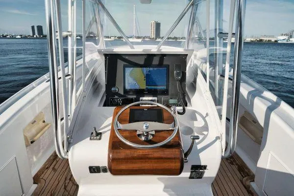 Candy Ride Yacht Photos Pics Helm of 2011 Winter Custom Yachts 29, featuring navigation equipment and wooden steering wheel.