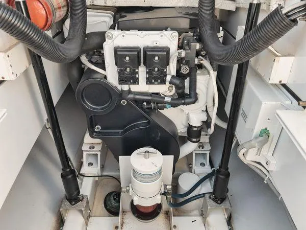 Candy Ride Yacht Photos Pics Engine compartment of a 2011 Winter Custom Yachts 29, showcasing mechanical components and wiring.