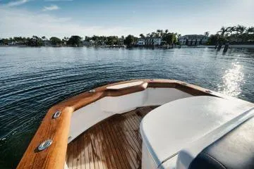 Candy Ride Yacht Photos Pics Bow view of 2011 Winter Custom Yachts 29 on calm water, showcasing wooden deck.