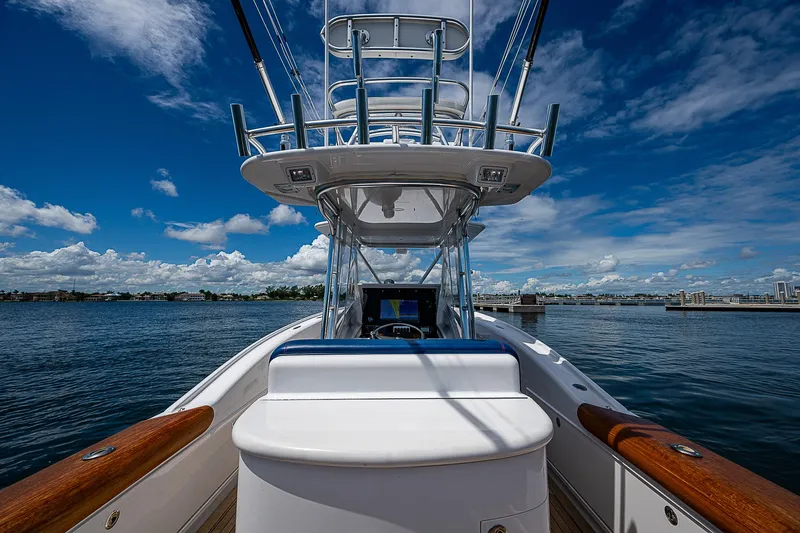 Candy Ride Yacht Photos Pics 2011 Winter Custom Yachts 29 on water, showcasing helm and tower under clear blue sky.
