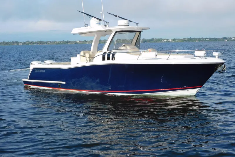 Happily Ever After Yacht Photos Pics 2016 Belzona 327 WA boat on calm water, featuring sleek design and modern amenities.