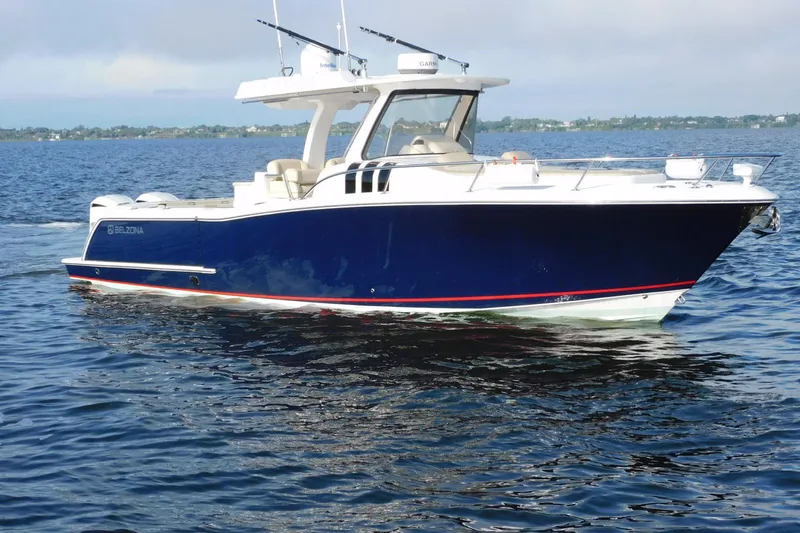 Happily Ever After Yacht Photos Pics 2016 Belzona 327 WA boat on calm water, featuring sleek design and modern amenities.