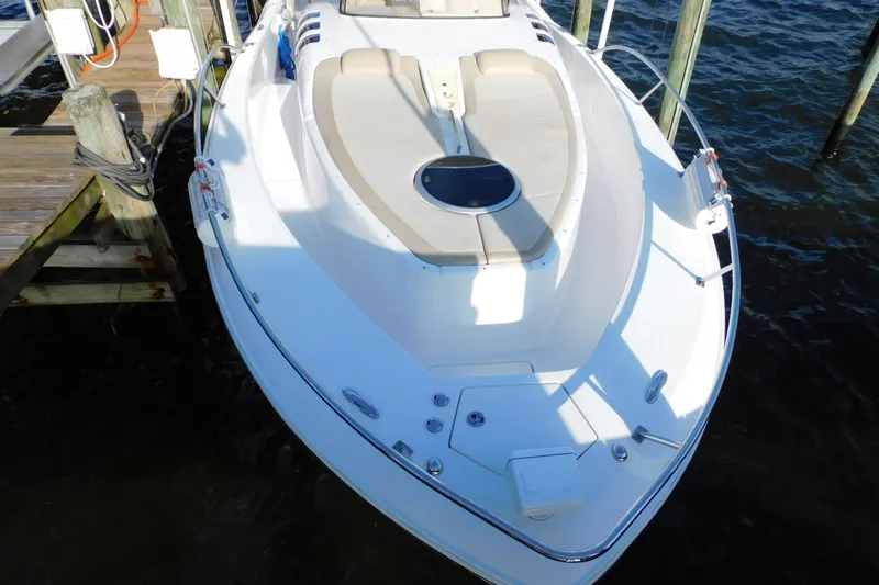 Happily Ever After Yacht Photos Pics 2016 Belzona 327 WA boat docked, featuring spacious deck and seating area.