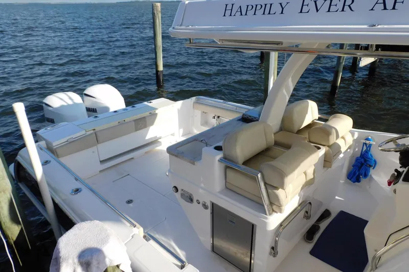 Happily Ever After Yacht Photos Pics 2016 Belzona 327 WA boat with Yamaha engines, docked by the water.