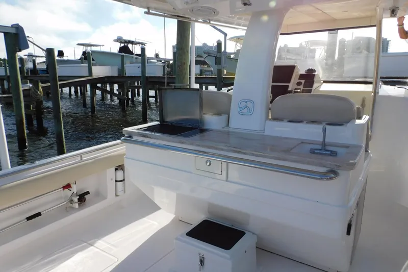 Happily Ever After Yacht Photos Pics Belzona 327 WA 2016 boat interior with seating and dock view.