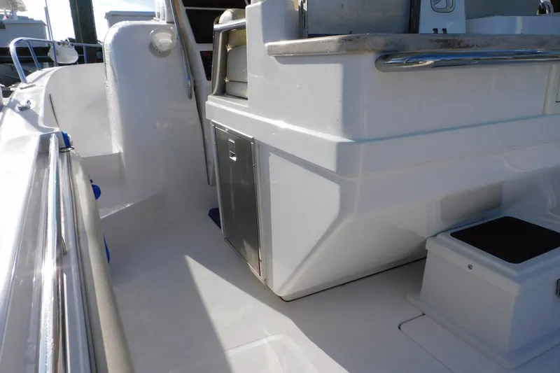Happily Ever After Yacht Photos Pics 2016 Belzona 327 WA boat interior with stainless steel fixtures and storage compartments.