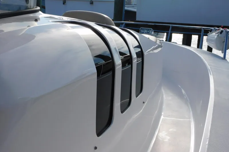 Happily Ever After Yacht Photos Pics 2016 Belzona 327 WA boat with sleek, modern design and reflective surfaces.