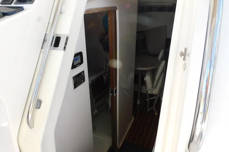 Happily Ever After Yacht Photos Pics Interior view of 2016 Belzona 327 WA boat cabin with seating area.