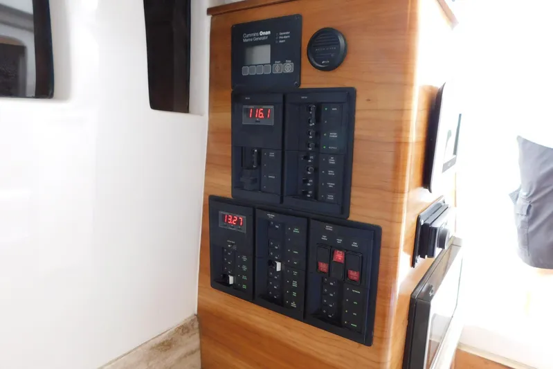 Happily Ever After Yacht Photos Pics Control panel of a 2016 Belzona 327 WA boat with digital displays and switches.