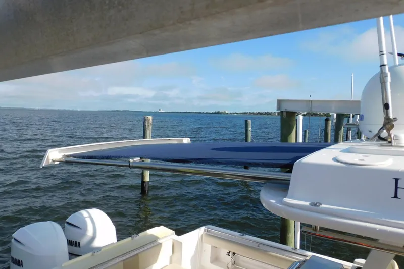 Happily Ever After Yacht Photos Pics 2016 Belzona 327 WA boat docked with Yamaha engines, overlooking calm waters.