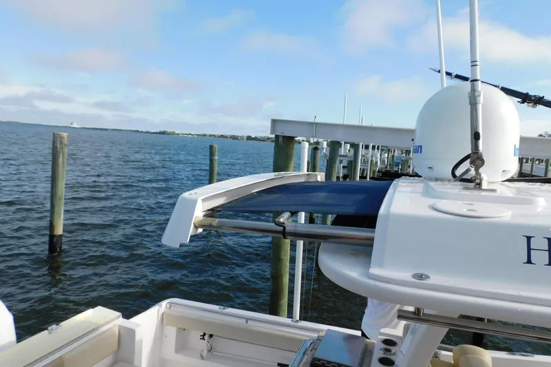 Happily Ever After Yacht Photos Pics 2016 Belzona 327 WA boat docked by the water with radar equipment.