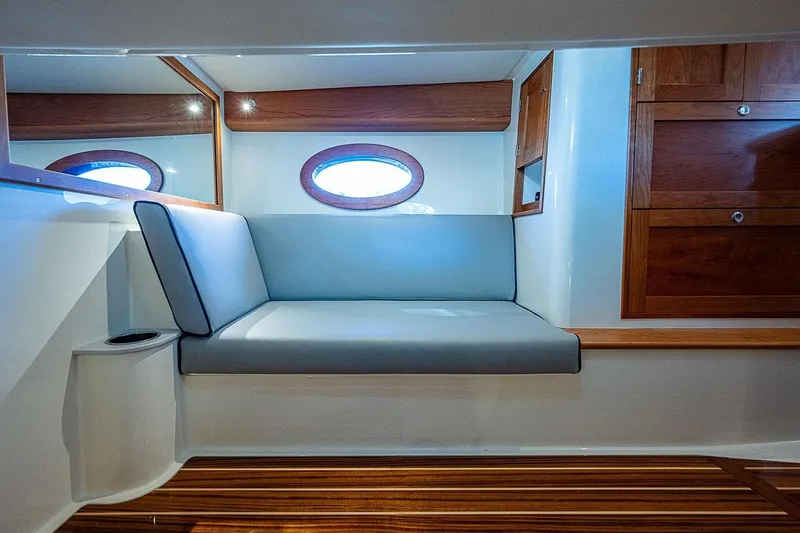  Yacht Photos Pics Luxurious interior of 2023 Hinckley 40x yacht with elegant seating and wooden accents.