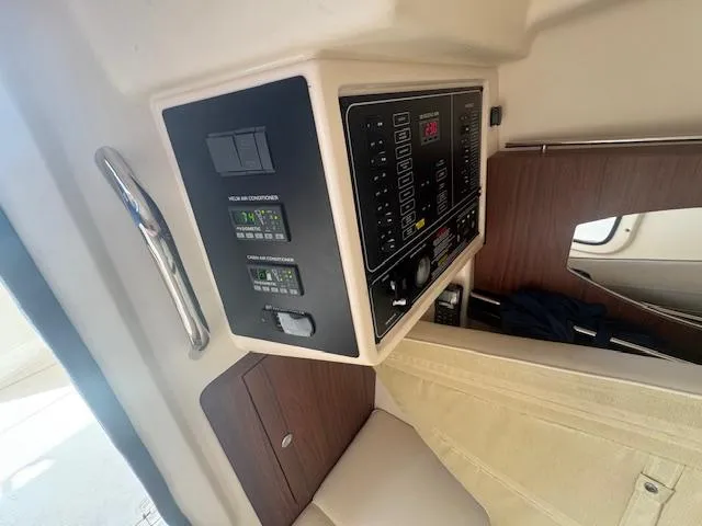 Texas Crewed Yacht Photos Pics 2024 Grady-White Freedom 335 cabin interior with control panel and seating.