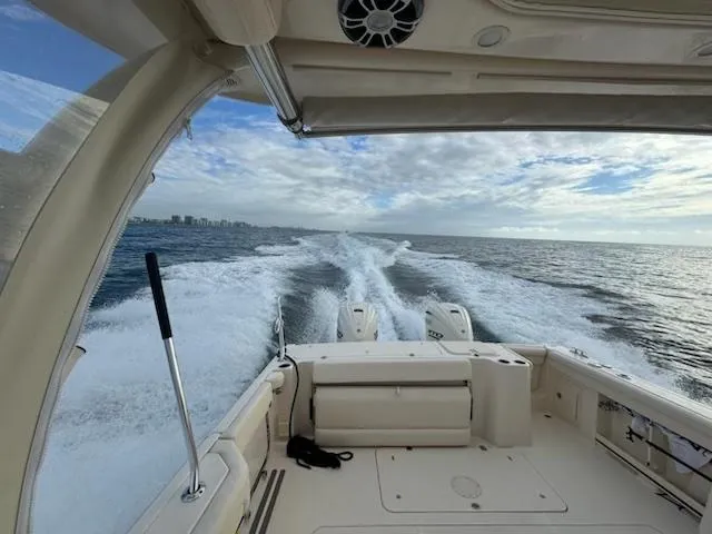 Texas Crewed Yacht Photos Pics 2024 Grady-White Freedom 335 cruising on open water, view from the deck.