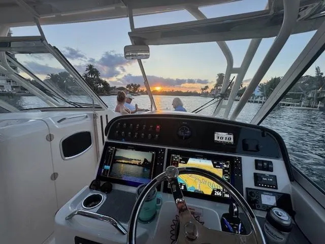 Texas Crewed Yacht Photos Pics 2024 Grady-White Freedom 335 boat interior with sunset view and advanced navigation system.