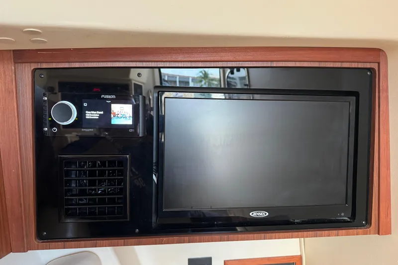 Texas Crewed Yacht Photos Pics 2024 Grady-White Freedom 335 interior with Fusion audio system and Jensen display.