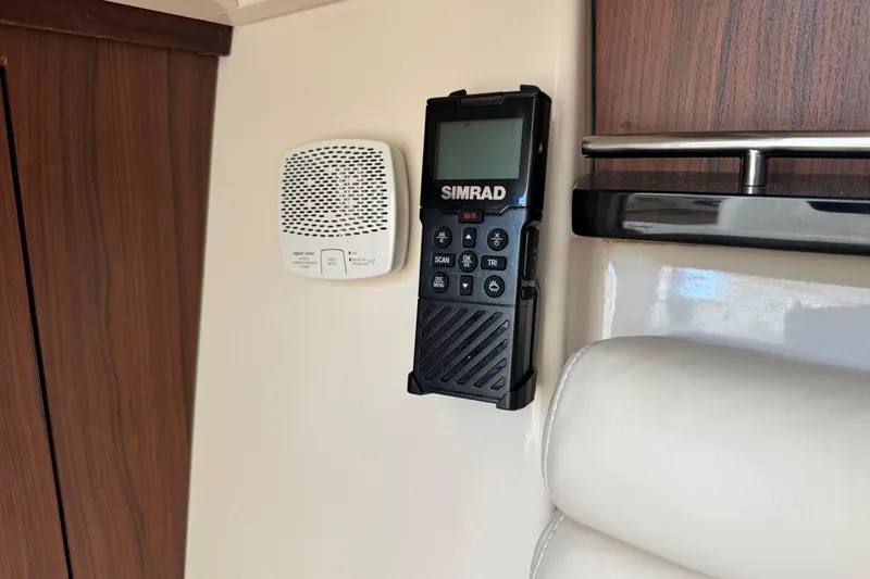 Texas Crewed Yacht Photos Pics Simrad radio and speaker on 2024 Grady-White Freedom 335 boat interior.