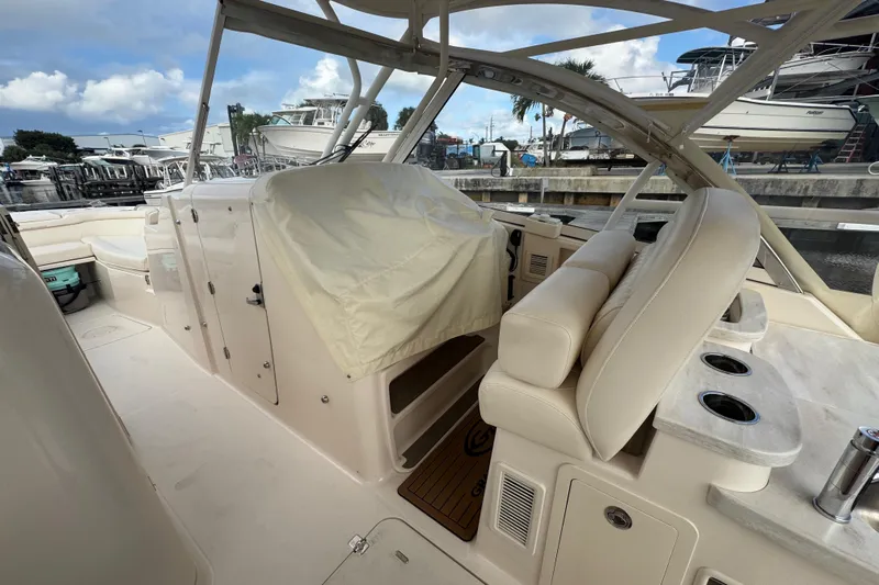Texas Crewed Yacht Photos Pics 2024 Grady-White Freedom 335 boat interior with covered helm and seating area.