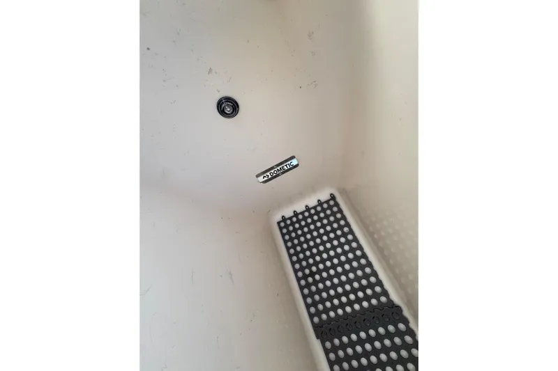 Texas Crewed Yacht Photos Pics 2024 Grady-White Freedom 335 boat interior with Dometic label and drainage feature.